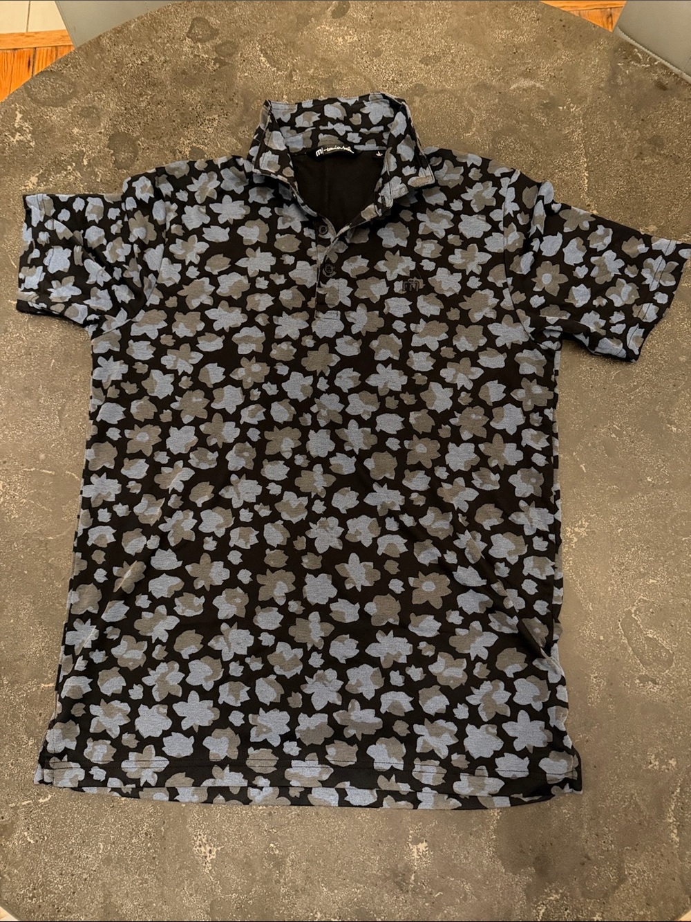 Travis Mathew Black Polo with Light Blue Floral Print